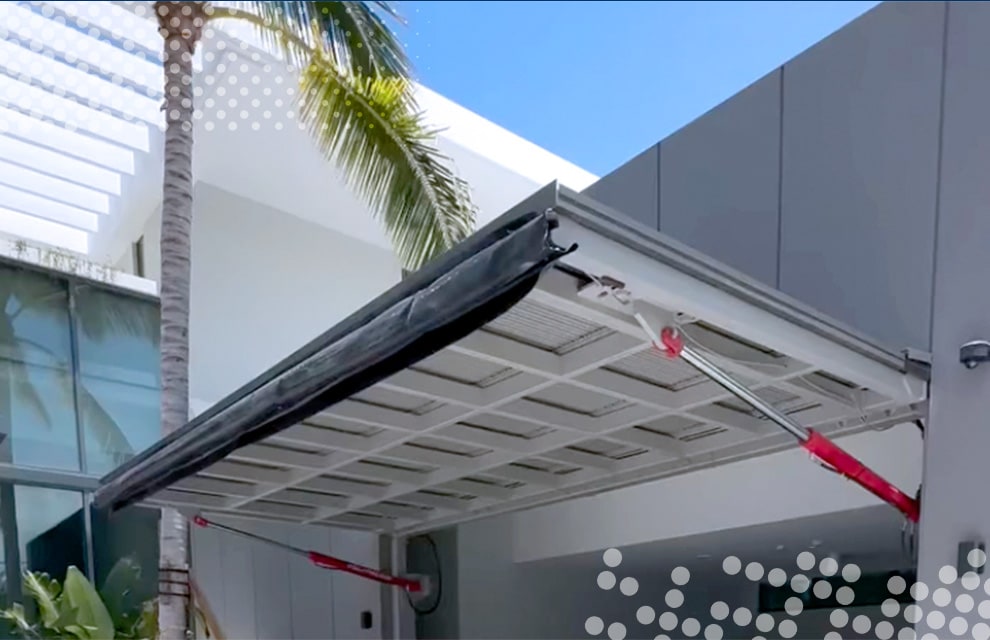 Schweiss hydraulic door fitted on Pro Garage in Florida shown open