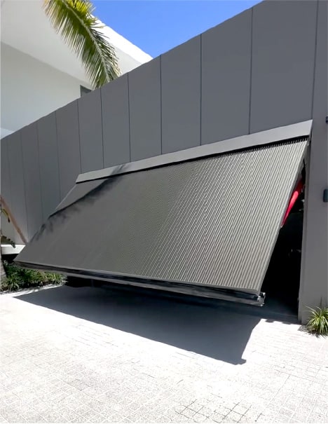 Schweiss hydraulic door fitted on Pro garage in Florida shown opening