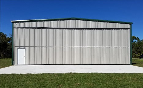 Schweiss bifold liftstrap door installed on Ray Cook's hangar shown closed