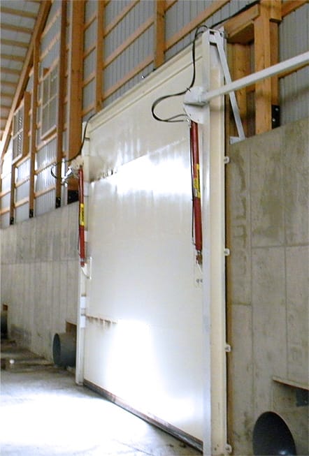 Interior view of Schweiss hydraulic door fitted on feed storage building at Revier Cattle Company