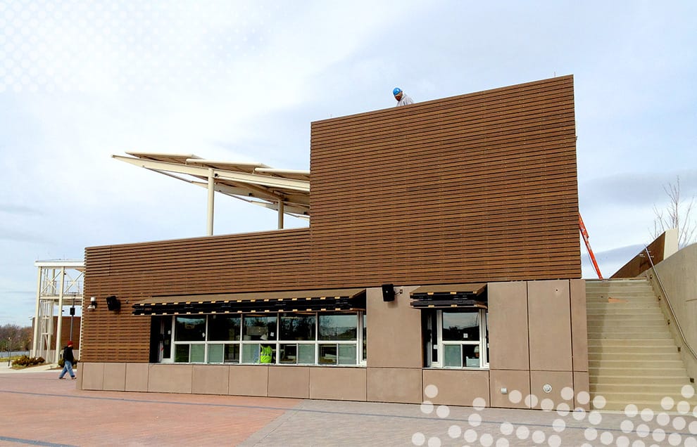 Schweiss bifolds used as window covers on the side of stage building and concession stand at Riveredge Park in Illinois