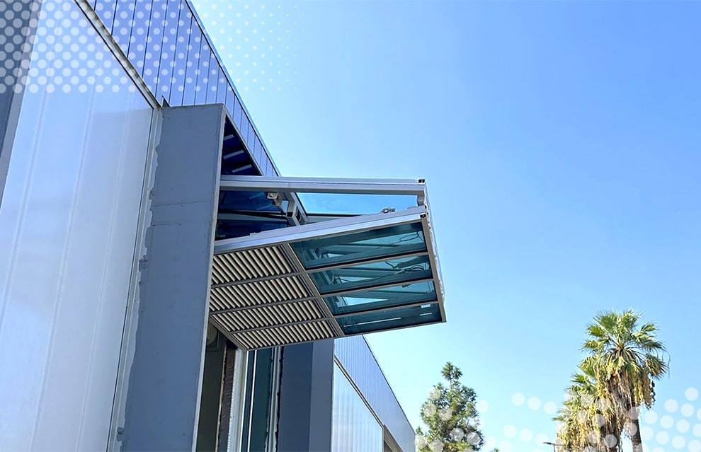 Open Schweiss glass bifold door installed on San Bernardino Valley College's tech building viewed from the left