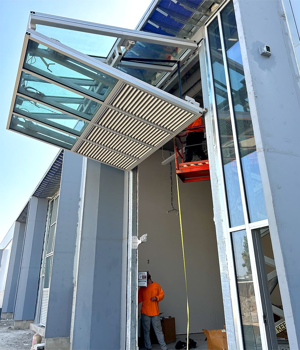 Open Schweiss glass bifold door installed on San Bernardino Valley College's tech building viewed from the right