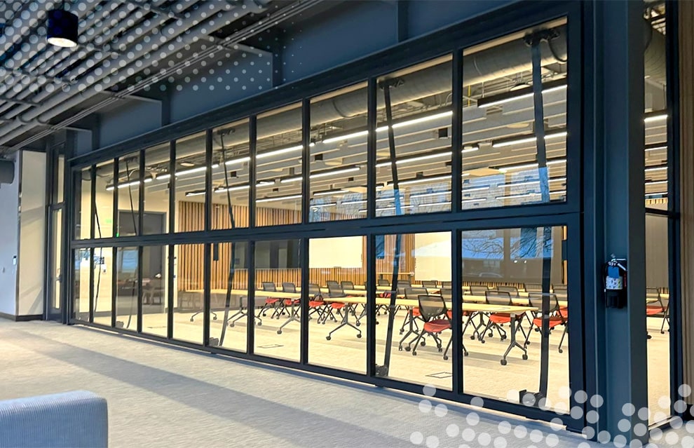 Schweiss bifold door cladded with glass installed on Colorado School of Mines Beck Venture Center shown closed