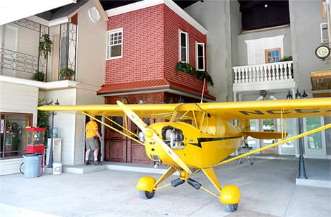 Interior view of Shaw hangar home showing parked airplane