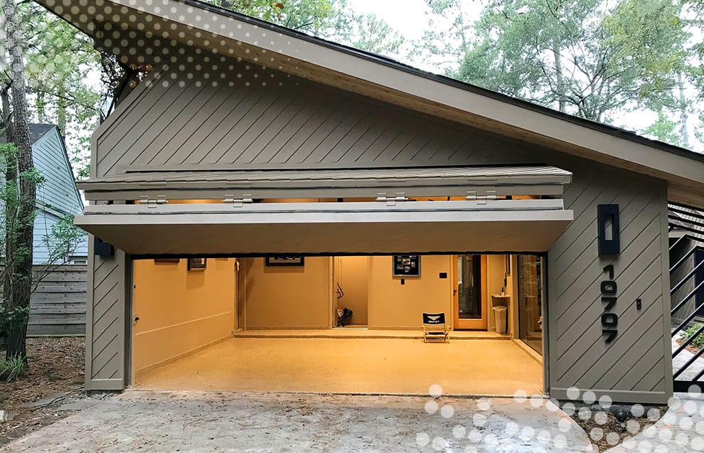 Custom Schweiss bifold door fitted on Simonds' garage shown in the open position