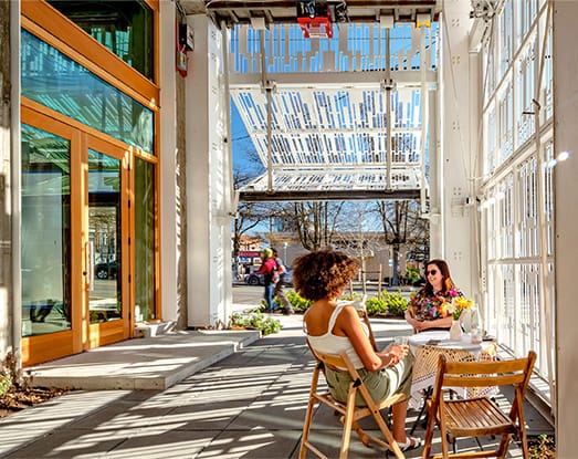 Interior view of Schweiss bifold doors in the open position on Solis Apartments