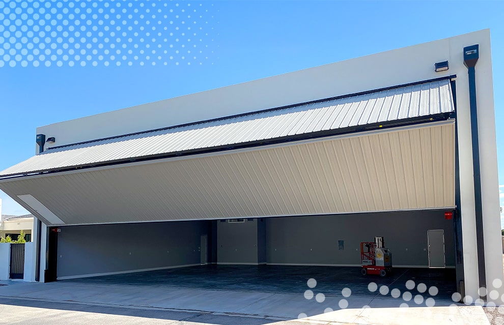 Schweiss bifold door fitted on hangar home in Stellar Airpark shown opening