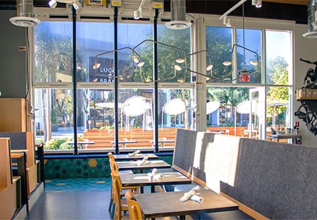 Interior view of Schweiss bifold door fitted on Superba Food + Bread shown in closed position