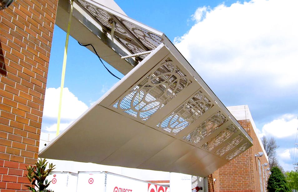 Custom Schweiss bifold door used as security gate on loading area at a Target store shown half-open