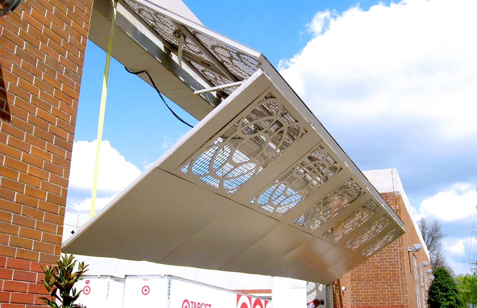 Custom Schweiss bifold door used as security gate on loading area at a Target store shown half-open