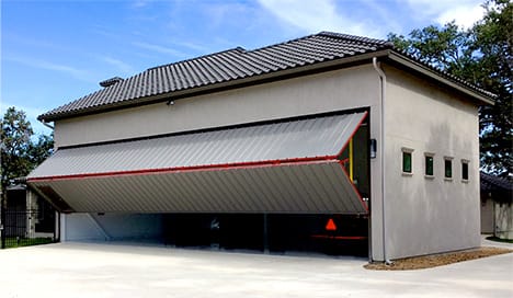 Schweiss bifold door installed on Texas Hangar Home shown opening