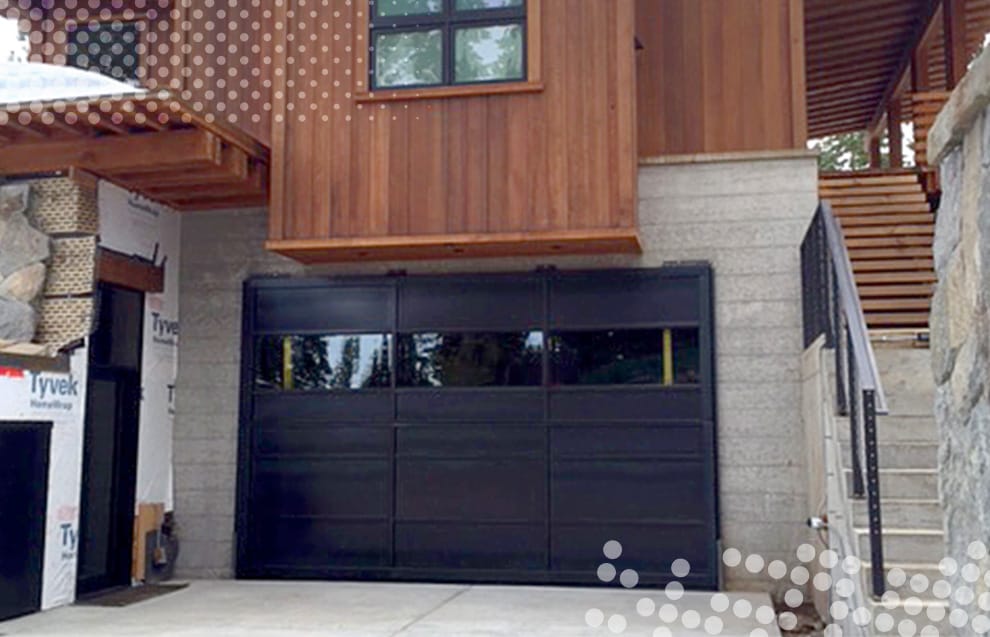 Custom Schweiss bifold door fitted on garage in Truckee, CA shown closed