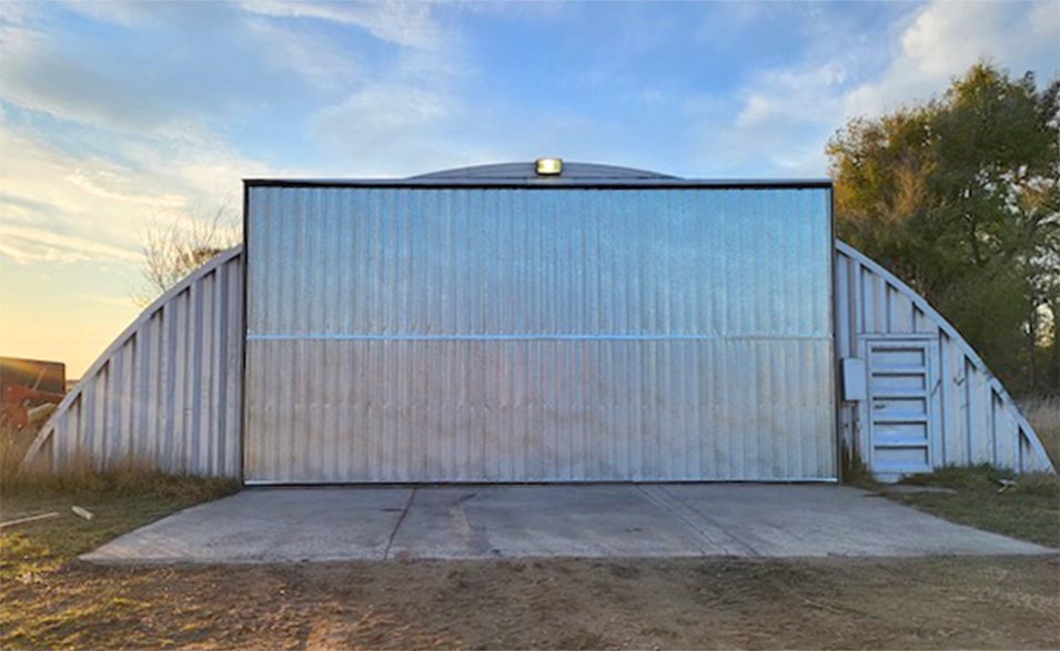 Schweiss bifold door fitted on quonset shed in South Dakota shown closed