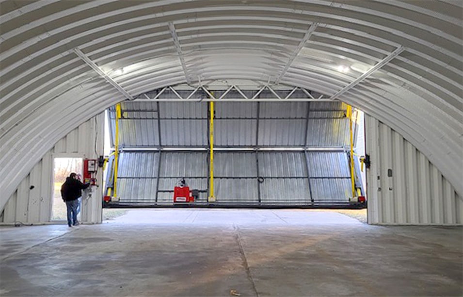 Interior view of Schweiss bifold door fitted on quonset shed in South Dakota