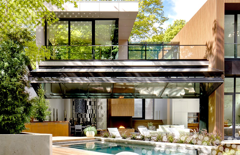 Exterior view of Schweiss bifold door fitted on Waxwing Residence shown during the day