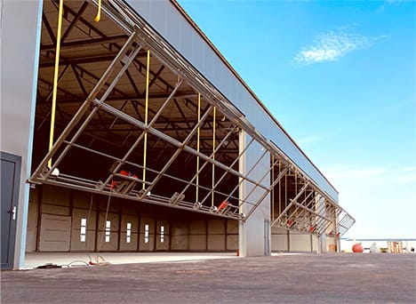 Schweiss bifold door frames fitted on Weiner Neustadt Airport hangar