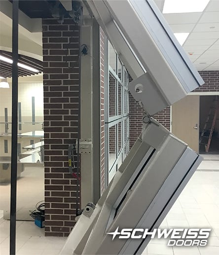 Side view of Schweiss Liftstrap door opening in action