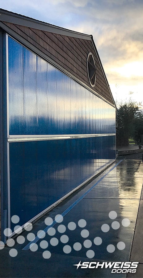 hangar door clad in blue polycarbonate
