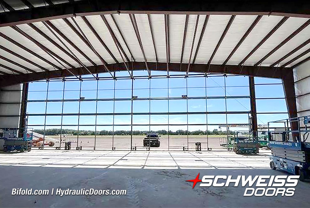 Interior view of 100ft Schweiss bifold frame installed on storage hangar shown closed