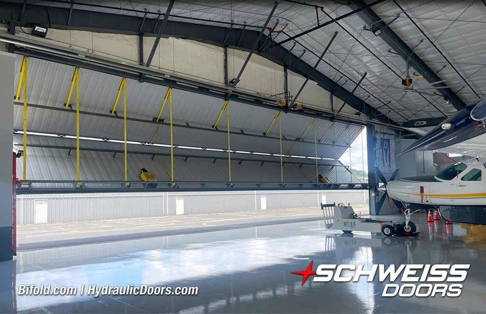 Interior view of Schweiss liftstrap bifold hangar door fitted on Brad Mottier's hangar shown opening