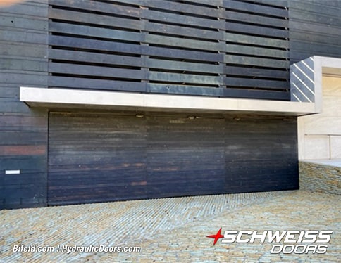 Exterior view of Schweiss hydraulic door installed on Brad Mottier's garage shown closed
