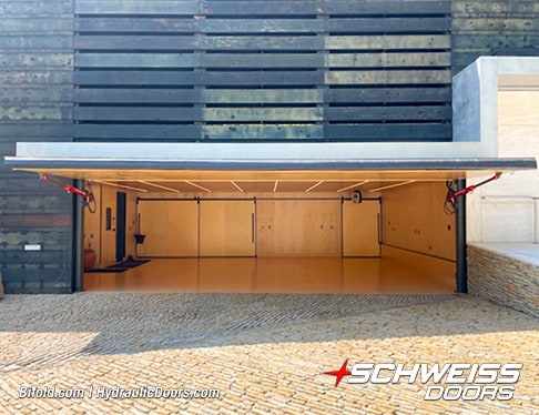 Exterior view of Schweiss hydraulic door installed on Brad Mottier's garage shown open