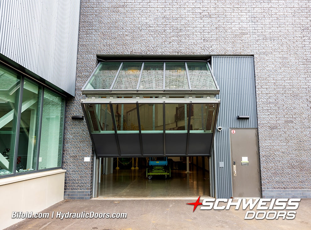 View from the front of Schweiss glass bifold door fitted on Cornell University lab shown opening
