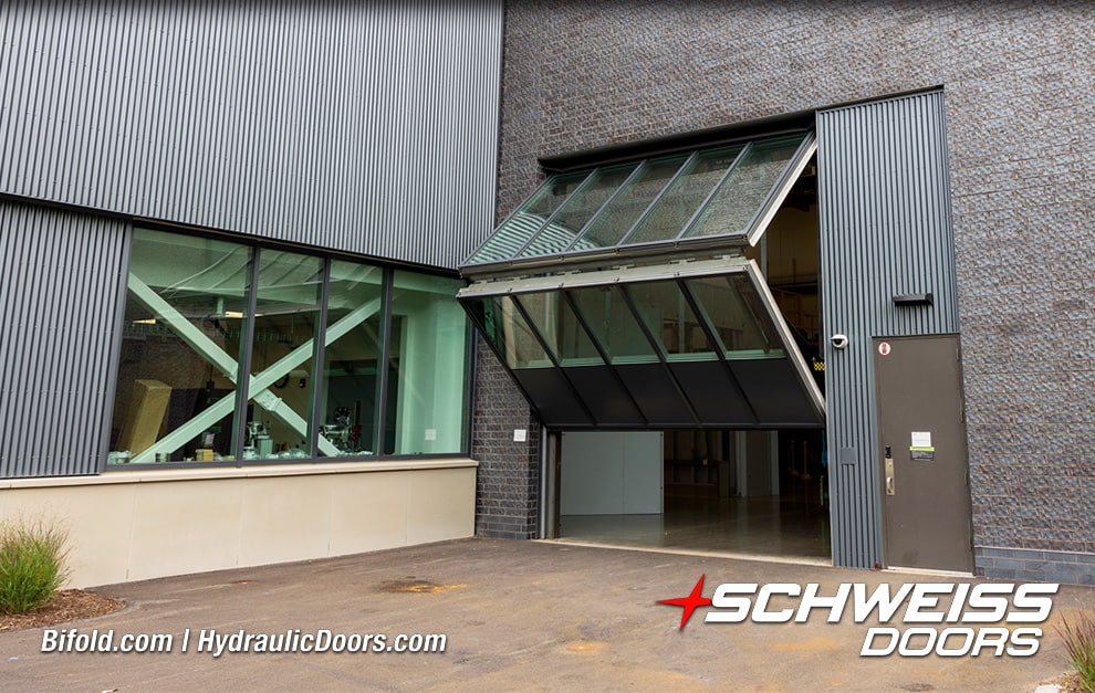 Angled view of Schweiss glass bifold door fitted on Cornell University lab shown opening