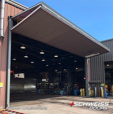 View from side of Schweiss bifold machine shed door fitted on Midwest Energy Resources building shown open
