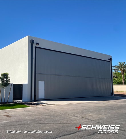 Schweiss liftstrap bifold hangar door installed by Rob Evans on hangar shown closed