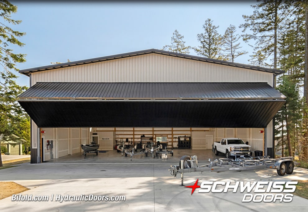 View from front of Schweiss bifold hangar door installed on Roche Harbor hangar shown open
