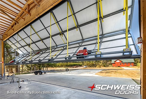 Interior view of Schweiss bifold hangar door installed on Roche Harbor hangar shown opening
