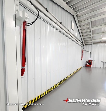 Interior view of Schweiss hydraulic door installed on building by Ross Helwig shown closed