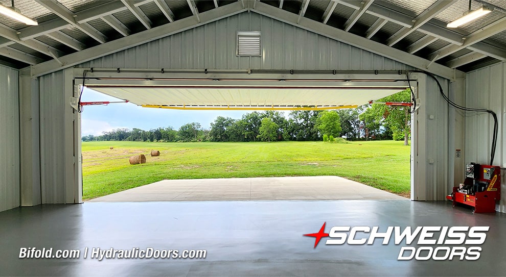 Interior view of Schweiss hydraulic machine shed door installed by Ross Helwig shown open