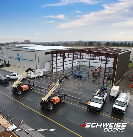 Schweiss bifold liftstrap hangar door frame being installed on SEI Hangar
