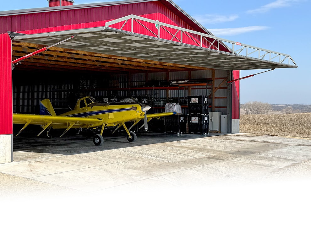 Schweiss Red Power pumps on hydraulic doors installed on aircraft hangars