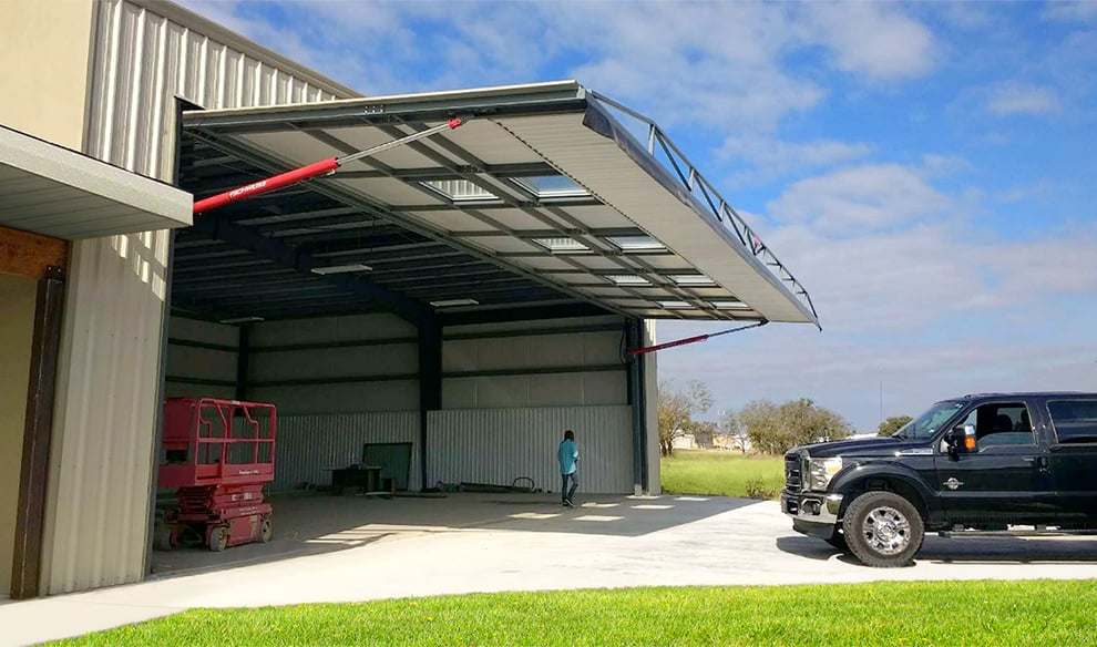 Schweiss Hydraulic Door installed on Hangar Home