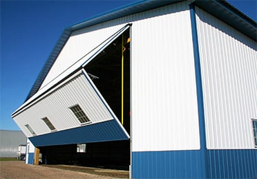 Schweiss bifold door fitted on building shown opening