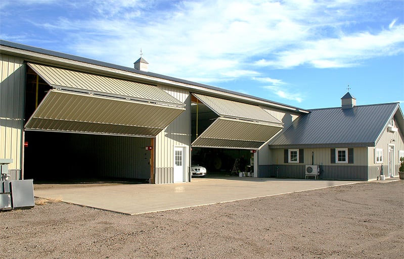 Multiple Schweiss bifold doors fitted on a building shown opening