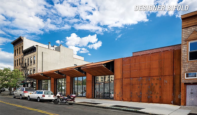 Multiple Schweiss Designer bifold doors fitted on a storefront in New York