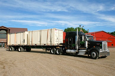 Black Schweiss semi truck with a full load ready to deliver