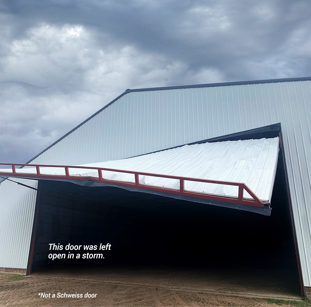 Hydraulic door that suffered a failure while open during a storm - not a Schweiss Door!