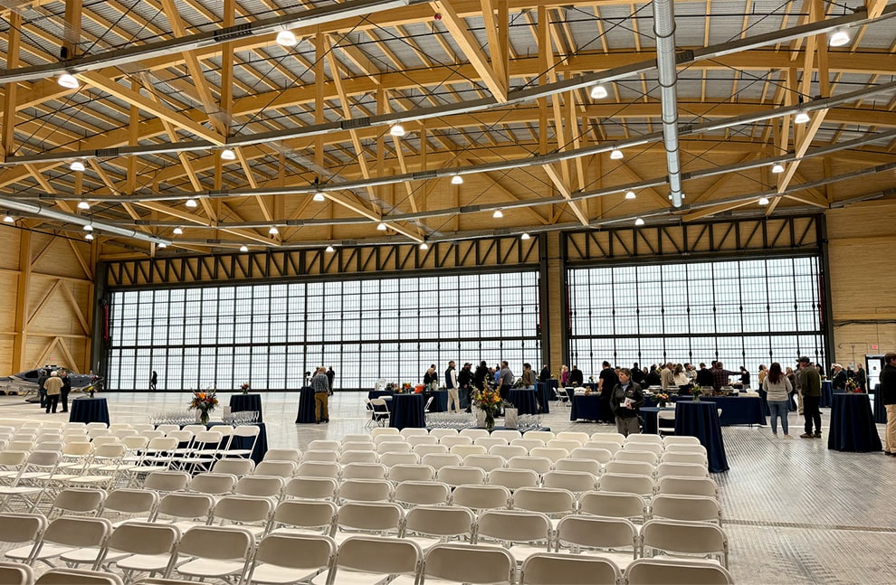 Event taking place in hangar fitted with two Schweiss hydraulic doors and 120ft and 50ft Schweiss free standing headers