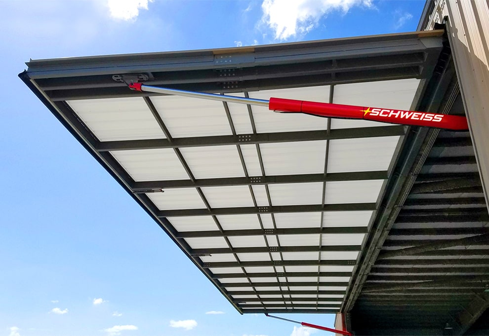 Opened Schweiss hydraulic door installed on hangar