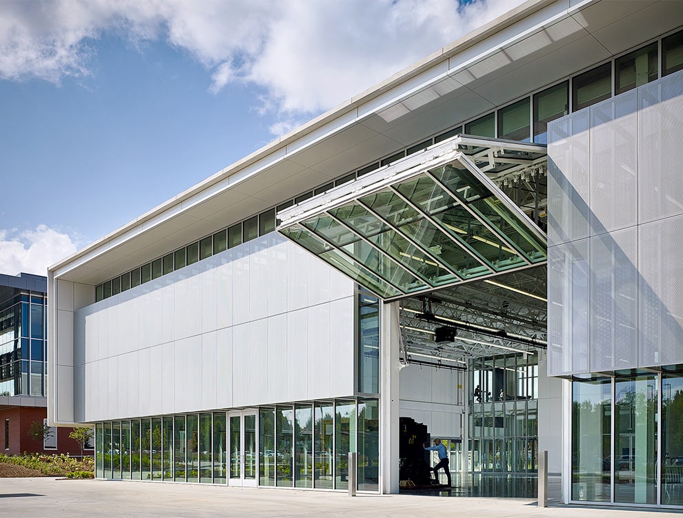 Schweiss glass bifold designer door fitted on commercial building shown open