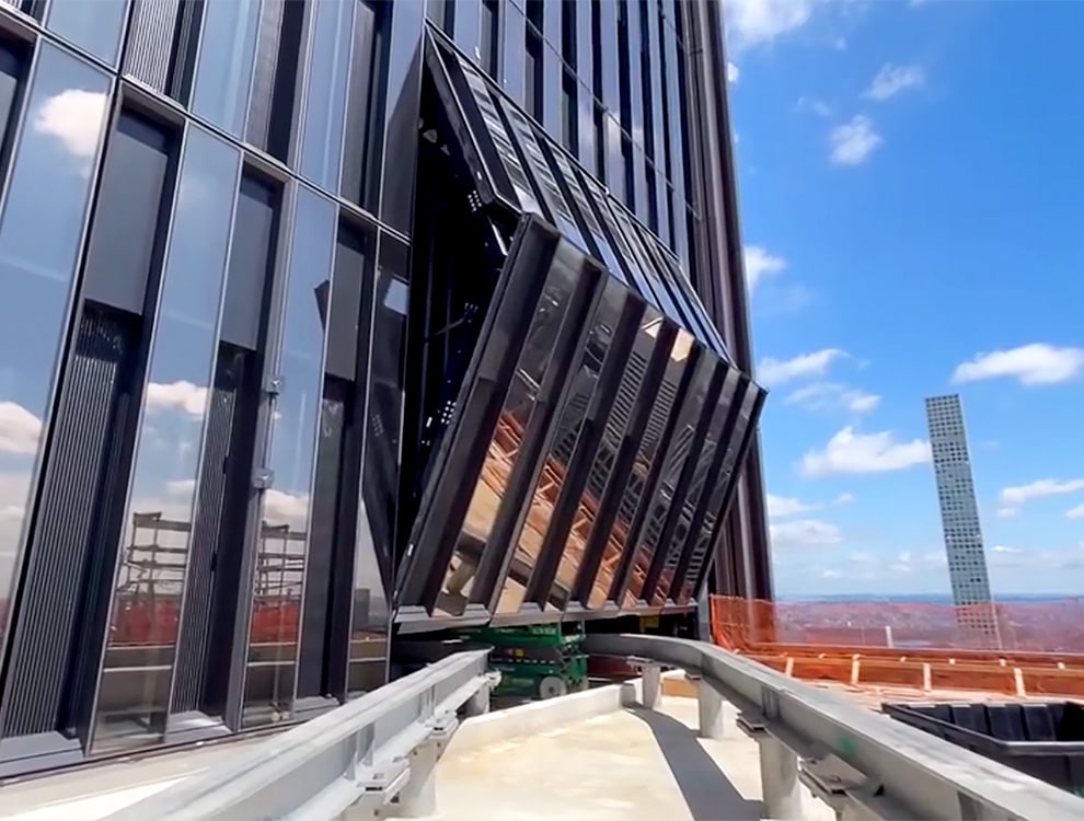 Schweiss incognito bifold designer door installed on JP Morgan headquarters shown opening