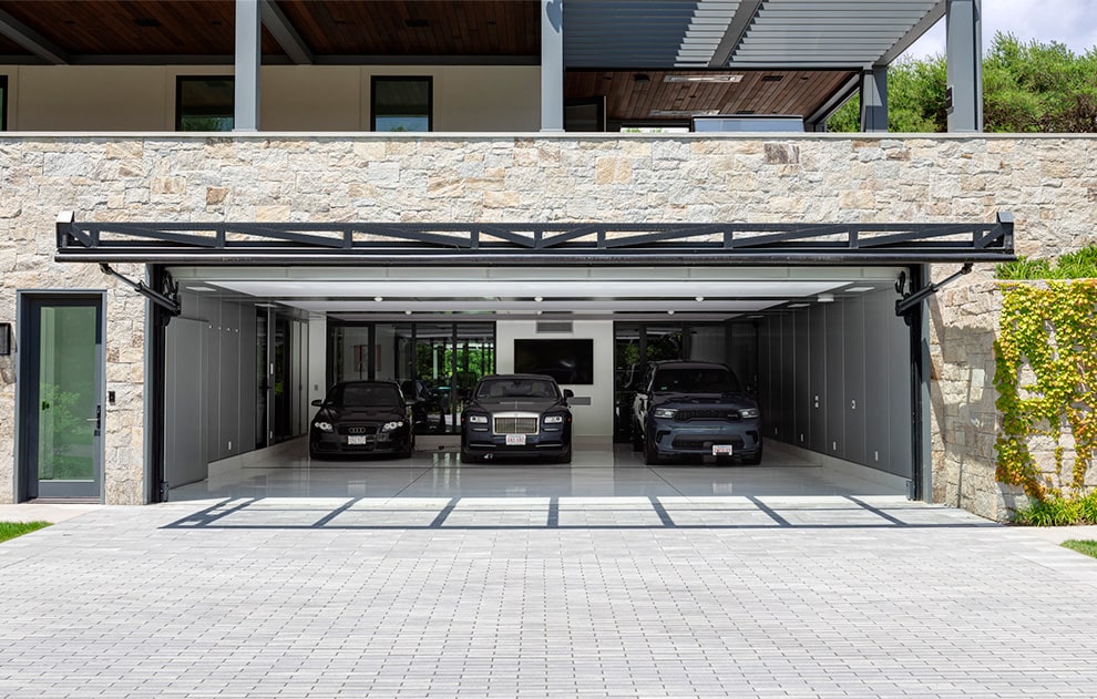 Schweiss glass hydraulic door fitted on residential home as garage door shown open
