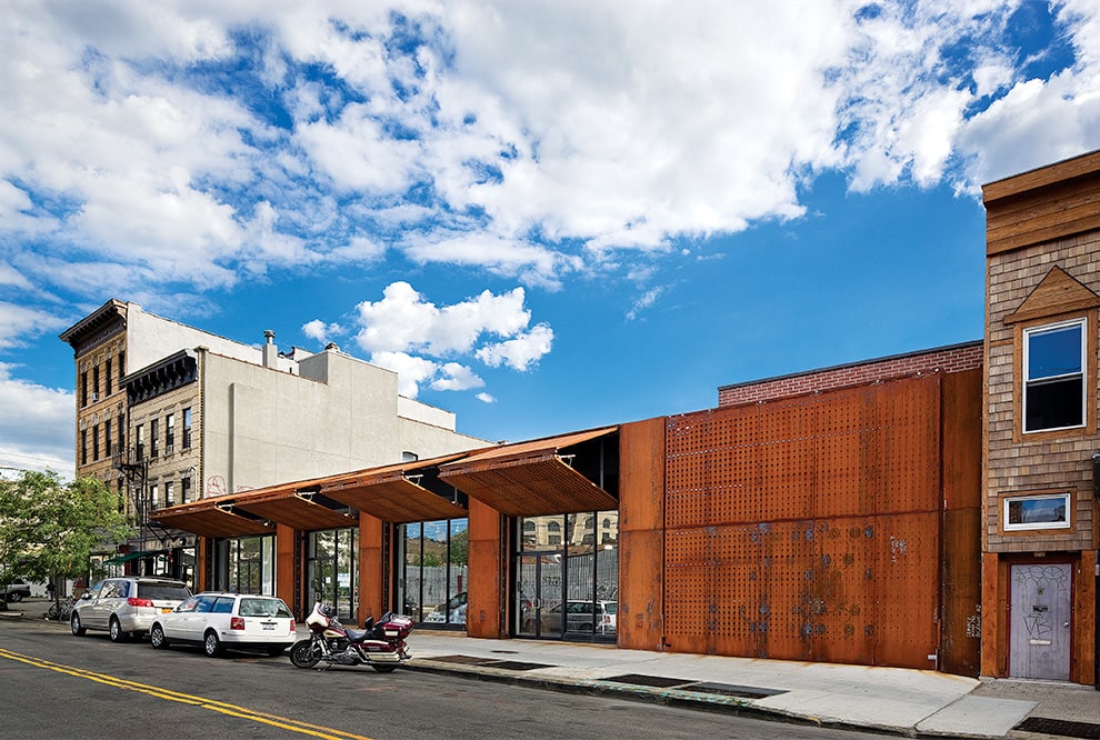 Multiple Schweiss bifold security doors installed on storefront in New York