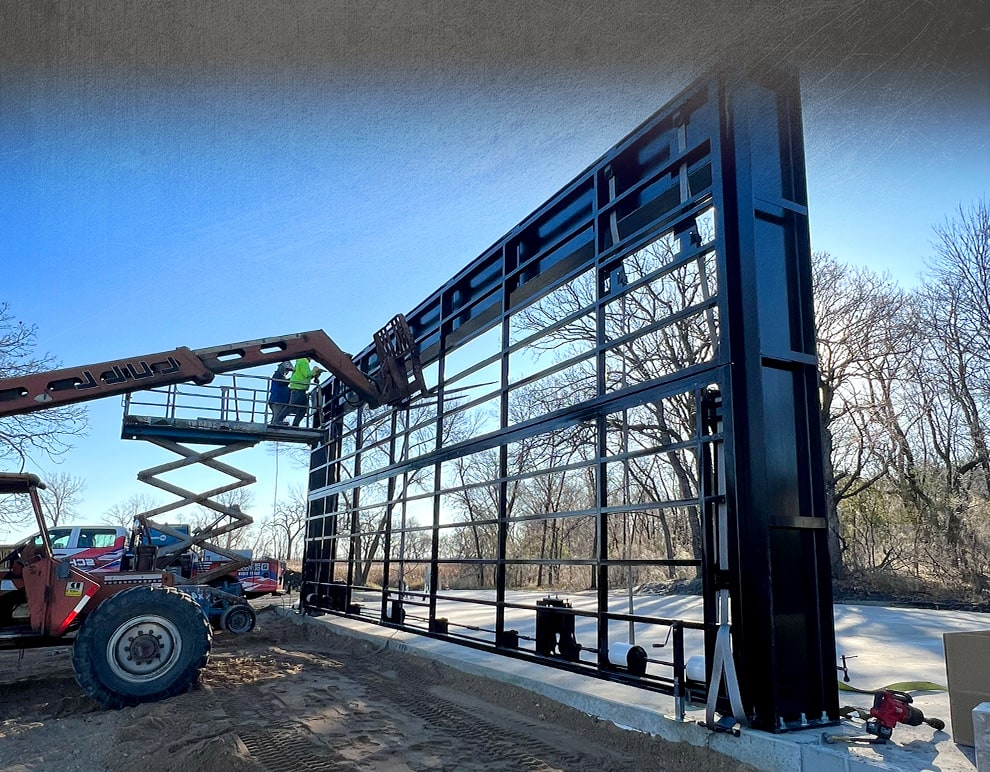 Schweiss stand alone door installed on cement slab prior to building construction shown closed